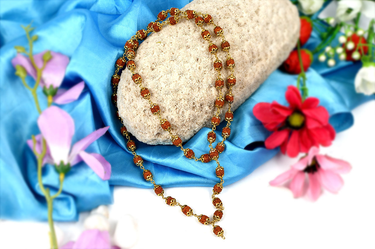 Rudraksha mala in designer gold polished caps - 7 mm